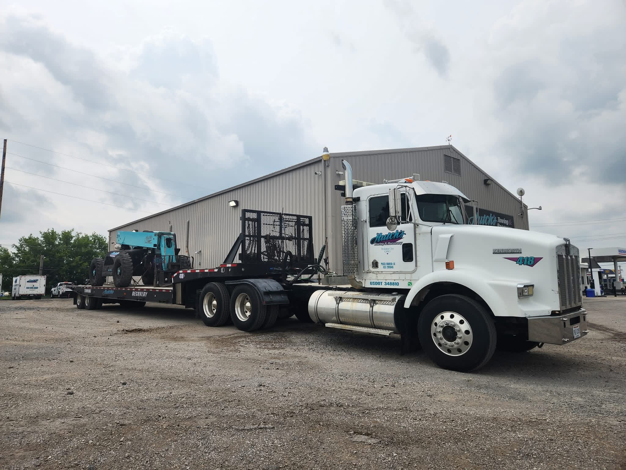 Hutch's hauling heavy equipment on a lowboy trailer